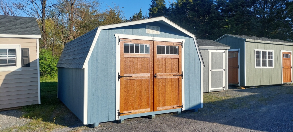 blue shed with wooden double doors