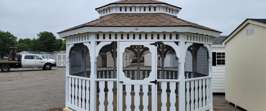 Wood gazebo in white and screened in