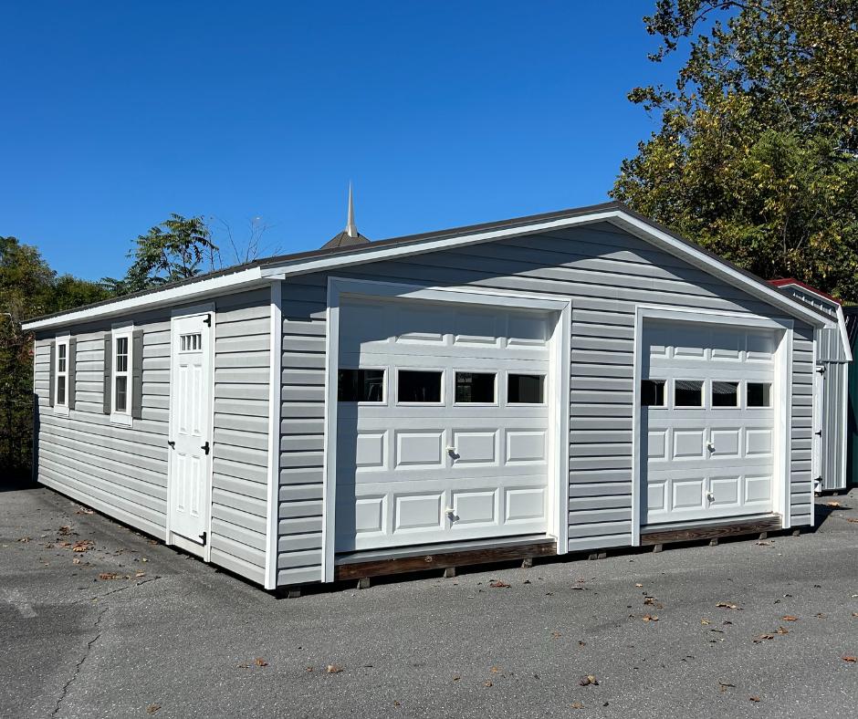 Garage with two bays/doors on a concrete lot